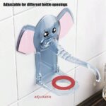 Adorable Elephant Design: Close-up View of Soap Dispenser Holder An elephant design soap dispenser holder in a bathroom setting, with a person pressing the dispenser pump for soap. More Affordable than Amazon, Meesho, etc