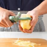 Close-up of 5-in-1 Tool Demonstrating Specific Function (e.g., Peeling a Potato) | Easy & Efficient Use