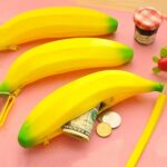 A banana-shaped silicone pencil case in a prominent color, featuring a zipper closure and playful design.