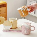 A ceramic coffee mug with a playful biscuit pattern in a prominent color (if applicable), displayed prominently - Crockery, kitchen items